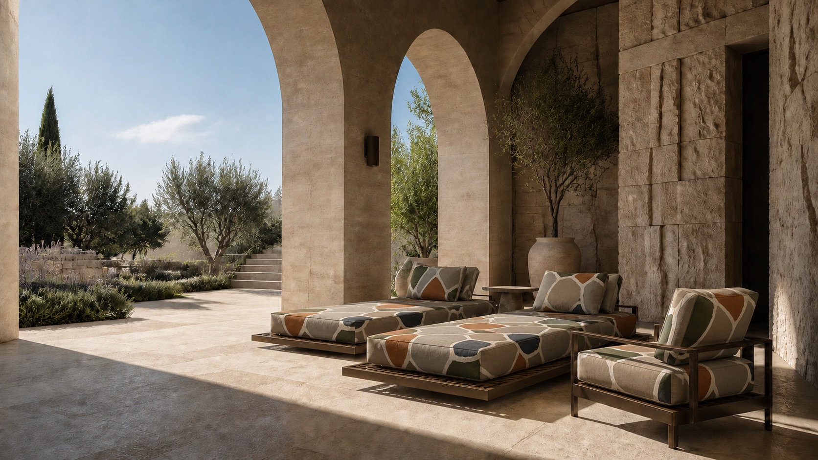 Outdoor resort seating upholstered in the MONOLITH design beneath a stone arcade.