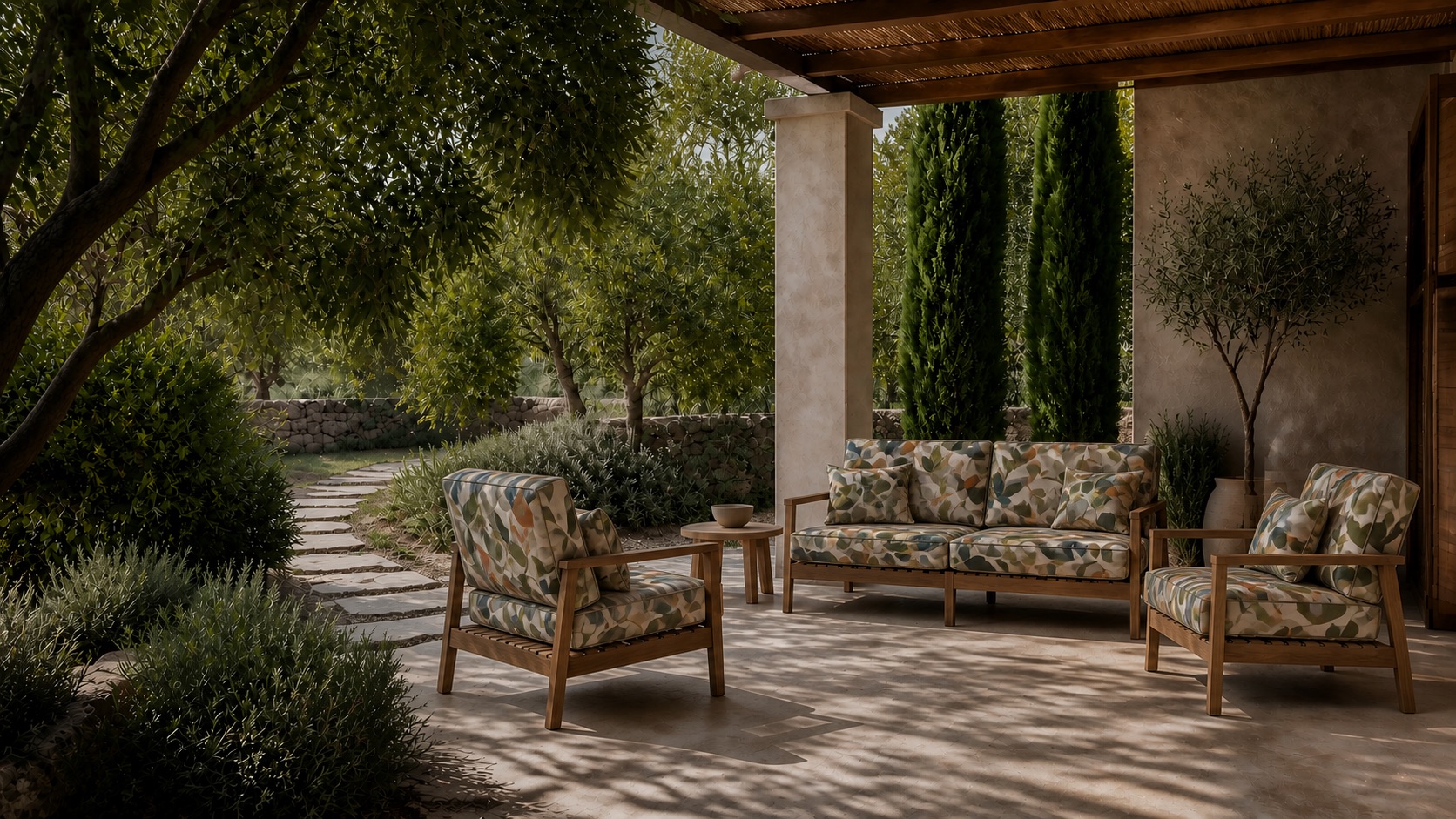 Garden lounge seating upholstered in the ARBOR design among olive trees.
