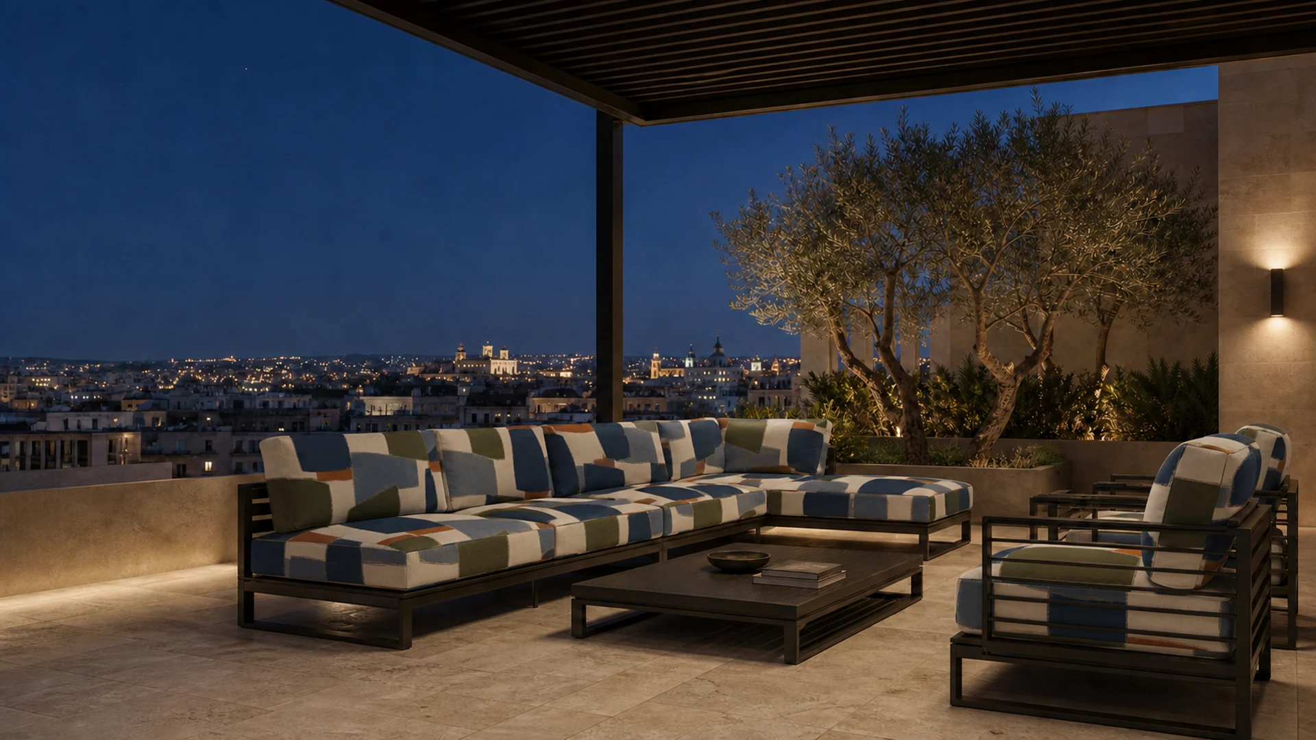 A rooftop terrace at dusk with a corner sofa and lounge chairs upholstered in the AFTERIMAGE design, city lights in the distance.